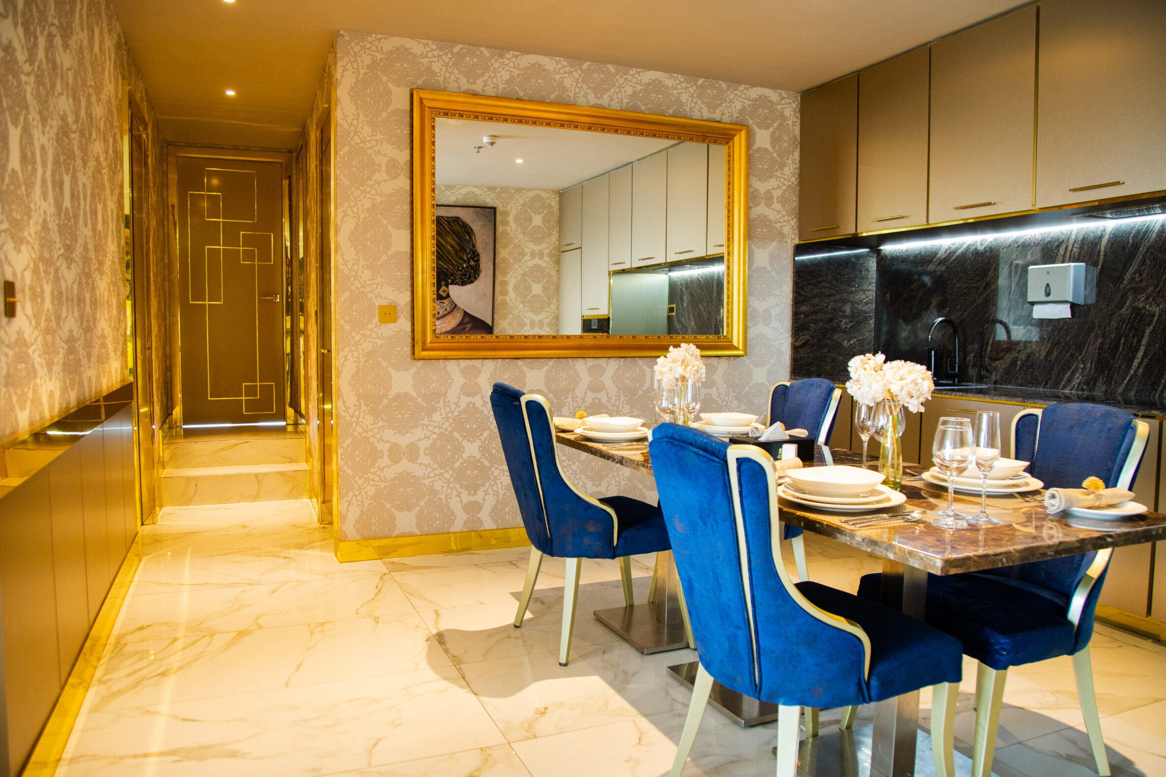 Dining area of the King Suite with a shot of the hallway to the bedrooms